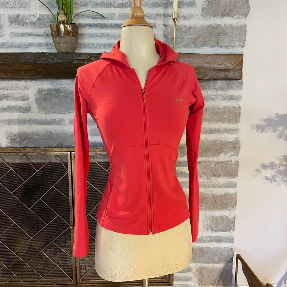 Red Reebok zip up stretchy light jacket with hood and pockets